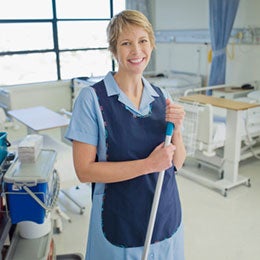 woman smiling while cleaning